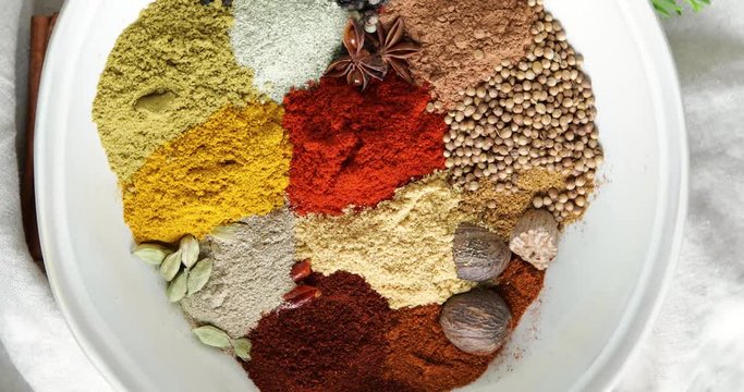 Different kind of spices in bowl for cooking. Top view 