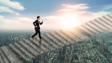 Fototapeta na wymiar businessman running on stair on sky over city, success and leader concept