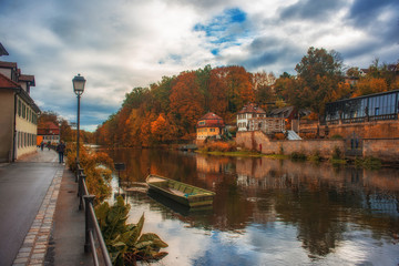 Fototapeta na wymiar Autumn scenery of Regnitz river in Bamberg, Germany. UNESCO World Heritage Site.