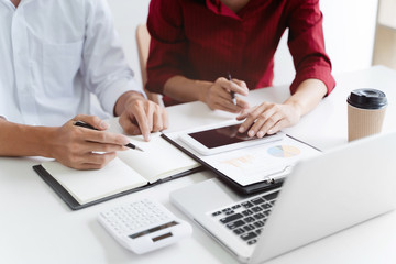 Team of Business people discussing a project of financial plan for marketing.