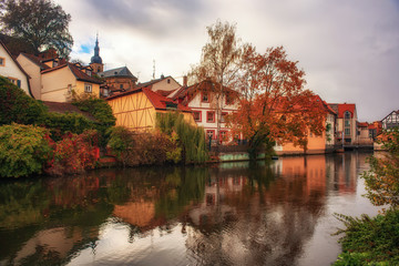 Fototapeta na wymiar Autumn scenery of Regnitz river in Bamberg, Germany. UNESCO World Heritage Site.