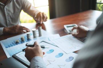 Team of Business people discussing a project of financial plan for marketing.