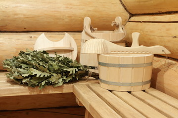 The main sauna accessories on the wooden bench in the sauna. 