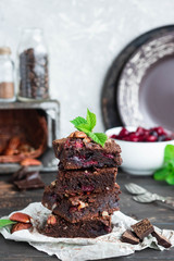 Chocolate brownie with berries and nuts