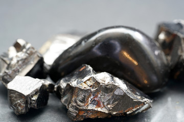 A black rock also called healing stone shungite, which consists mainly of carbon was photographed...