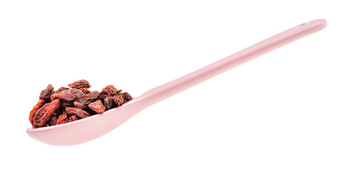side view of ceramic spoon with dried goji berries
