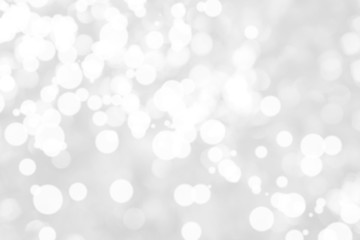 Abstract background with White bokeh on gray background. christmas blurred beautiful shiny Christmas lights.
