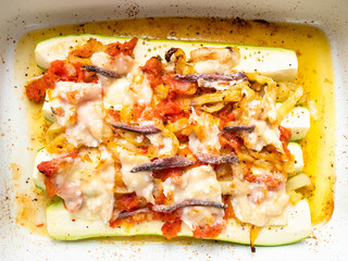 Zucchini baked with vegetables in baking dish