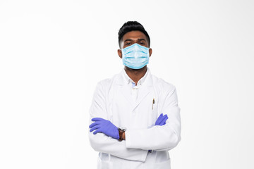 Handsome Indian Male Doctor with surgical or safety health Mask on. standing isolated over white background