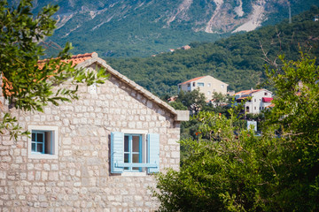 Fototapeta na wymiar house with blue shutters in Montenegro