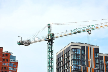 Crane and highrise construction site