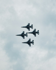 Fototapeta na wymiar Thunderbirds flying over the Cleveland Skyline at the Air Show