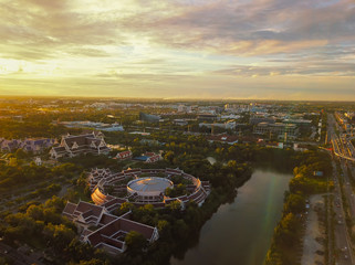 Beautiful sunset sky above the city with sky blue and orange light of the sun through the clouds in the sky, Orange and red dramatic colors, Warm color - Image