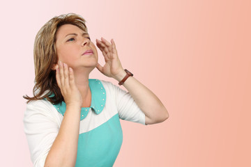 pretty middle-aged woman with facial expressions of fatigue, she raised her hands to her head, copy...