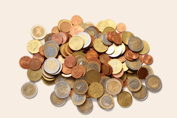 a large pile of metal coins of the European Union in bulk