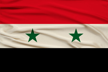 beautiful photograph of the national flag of Syria on delicate shiny silk with soft draperies, the concept of state power, country life, horizontal, close-up, copy space