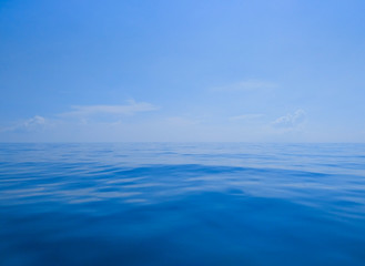 Deep blue sea and blue sky in the foggy day 