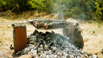 Mackerel, perch, sea bass, dorado, mullet, tuna. Close-up shot of fish grilled over charcoal. 4K
