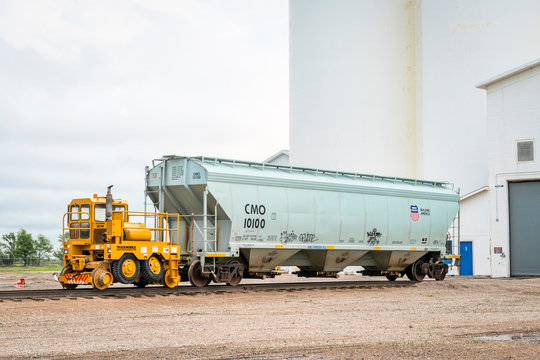 Grain Railcar With A Mobile Car Mover