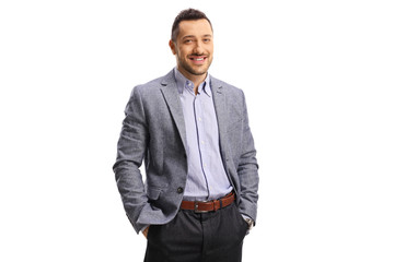 Young elegant man posing with hands in pockets