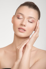 woman with clean skin touches her cheek with her hand. Perfect face skin concept on a white