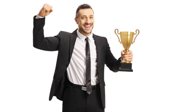 Happy Man In A Suit Holding A Gold Trophy Cup