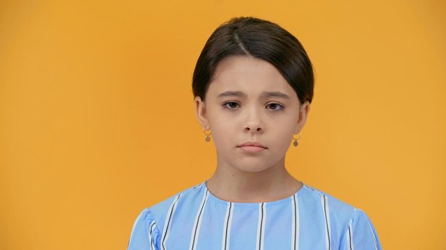 sad preteen child hardly breathing isolated on yellow
