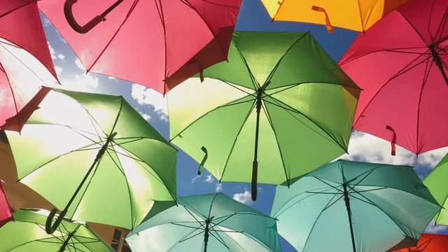 Hanging umbrellas on street.