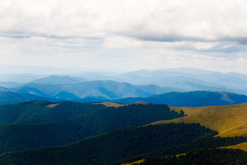 Mountain landscape with beautiful clouds before the rain. Location place Ukraine Carpathian meadow Borzhava.