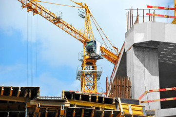 Crane and highrise construction site