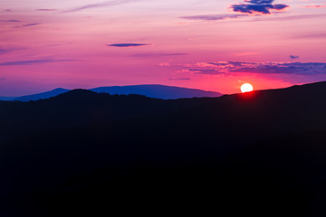 Purple sunset landscape in the mountains. Location place Ukraine, Borzhava ridge.