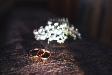 gold wedding rings in the sun
