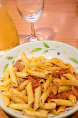 Pasta alfredo penne with tomato based sauce