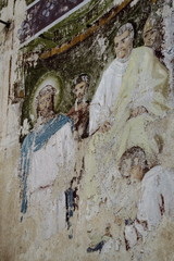 Old fresco depicting Jesus Christ and Pontius Pilate on wall of destroyed Christian Orthodox Church of Nicholas Wonderworker. Concept of religion, culture, Christianity, faith. Traveling in Russia.
