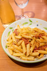 Pasta alfredo penne with tomato based sauce
