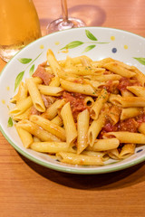 Pasta alfredo penne with tomato based sauce