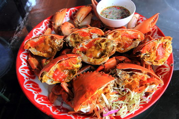 Boiled crab fresh with seafood spicy sauce Thai seafood, Crab showing crab's eggs inside shell.