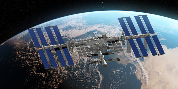 3d rendered illustration of the ISS infront of the earth