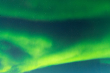 Naklejka na ściany i meble Amazing bright aurora borealis on night starry sky