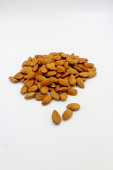 pile of almonds isolated on white background