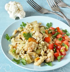 keto recipe. chicken and cauliflower rice. low carbohydrates, lots of protein. protein nutrition. stewed with celery and carrots.