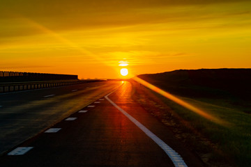 pink sunset on the expressway to the mountains