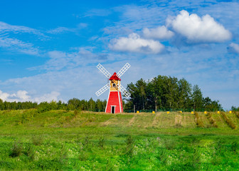 Bee windmill in apiary with bees