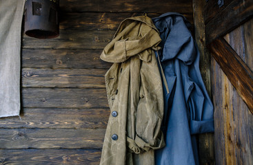 old textured wooden wall with clothes