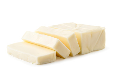 Cream cheese rectangular shape cut into pieces on a white, isolated.