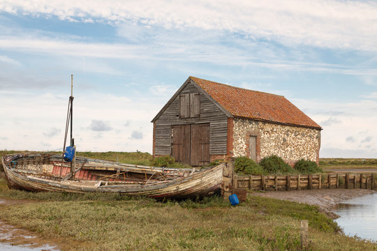 Old Coal Barn And Boat / An image of the old coal barn and boat at Thornham, Norfolk, England, UK