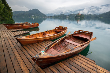 Wooden boats at the pier in Bled lake in Slovenia