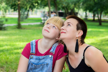 Mom and daughter look up