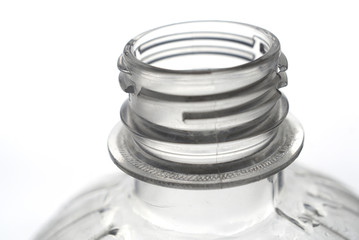  open plastic bottle on light background close up           