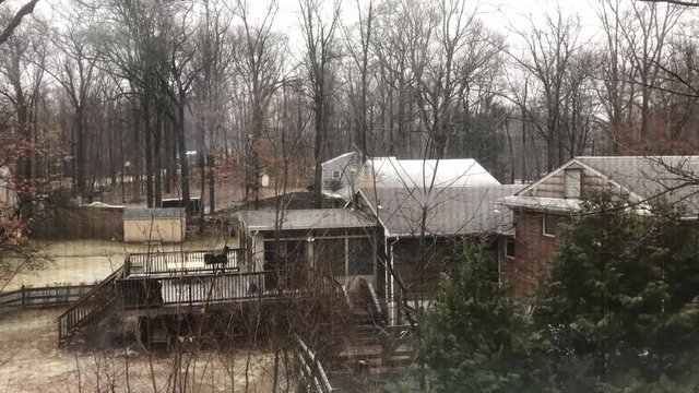 time-lapse looking at snow falling through the window